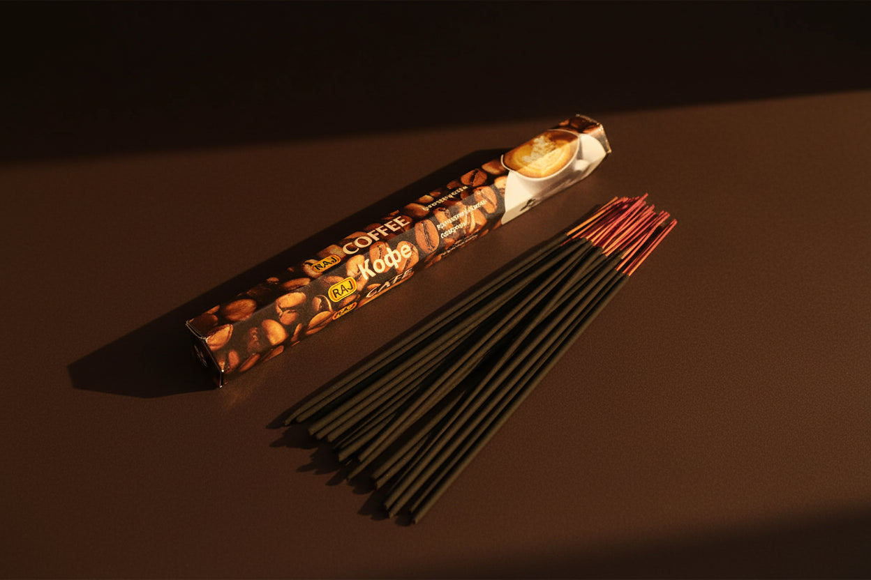 Incense sticks with packaging labeled 'COFFEE' on a white background